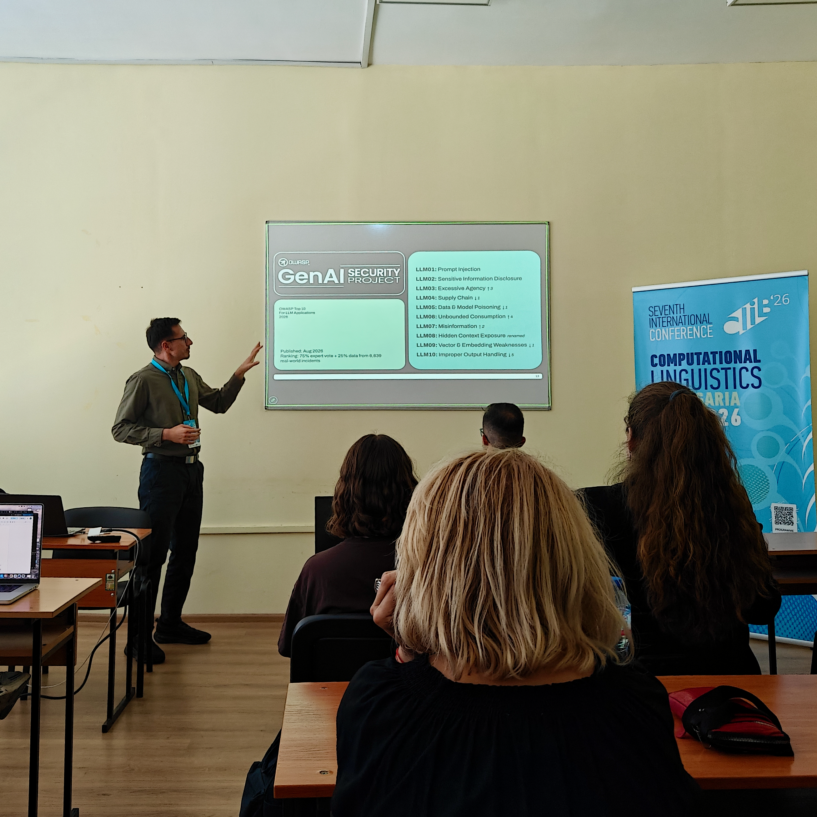Stihia presenter running a demo at a laptop, with a coding agent projected on the wall